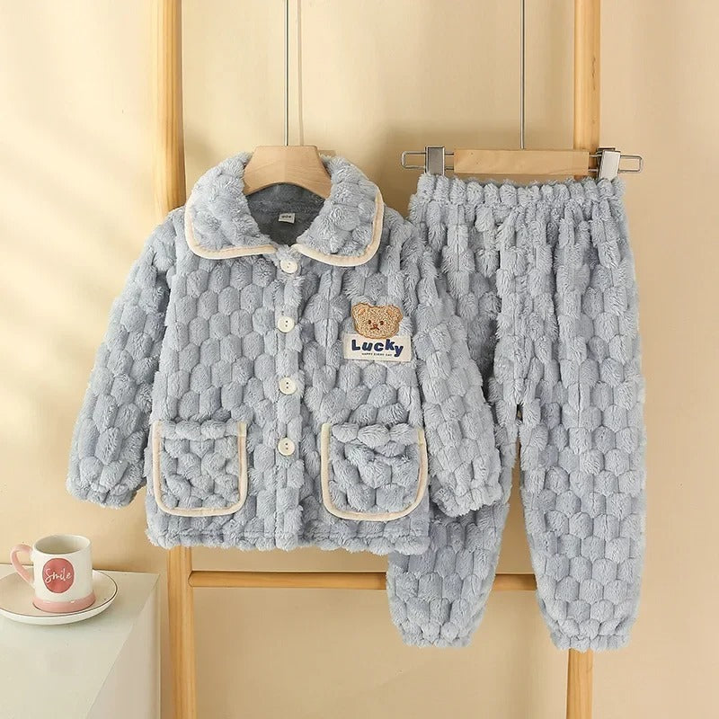 Ensemble de pyjama chanceux des enfants duvets